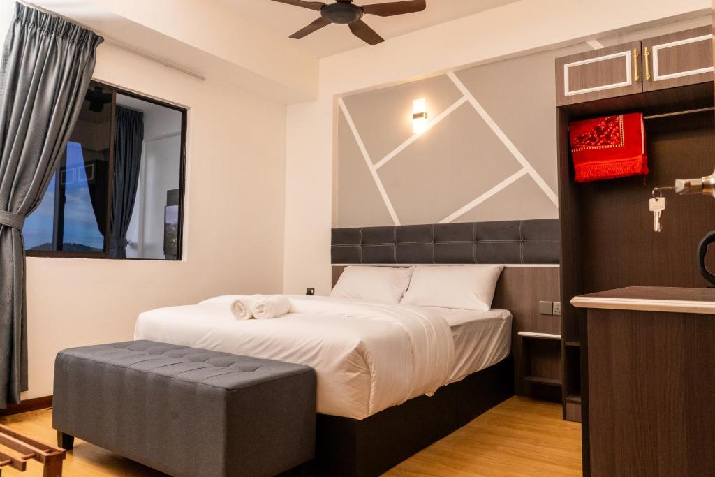 Rúm í herbergi á Sunrisestay