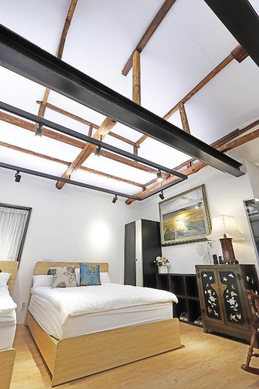 Ein Bett oder Betten in einem Zimmer der Unterkunft Jian Hanok