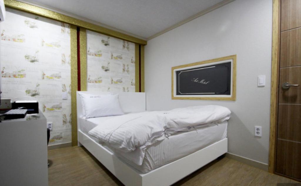 Postel nebo postele na pokoji v ubytování Art motel