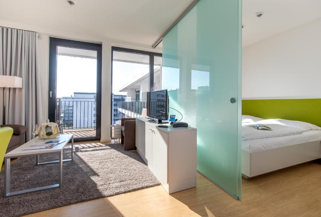 Postel nebo postele na pokoji v ubytování Carat Apartments Grömitz