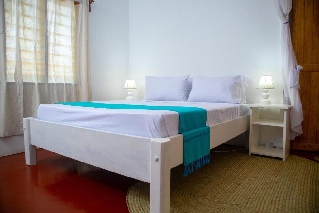 Postel nebo postele na pokoji v ubytování Gabsgate Resort