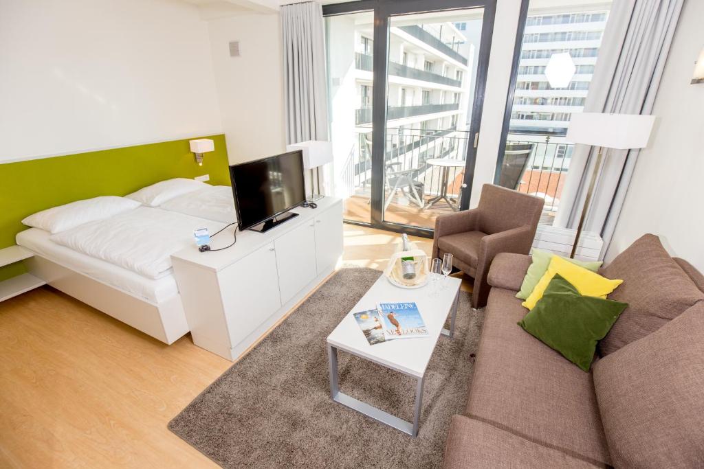 Postel nebo postele na pokoji v ubytování Carat Apartments Grömitz