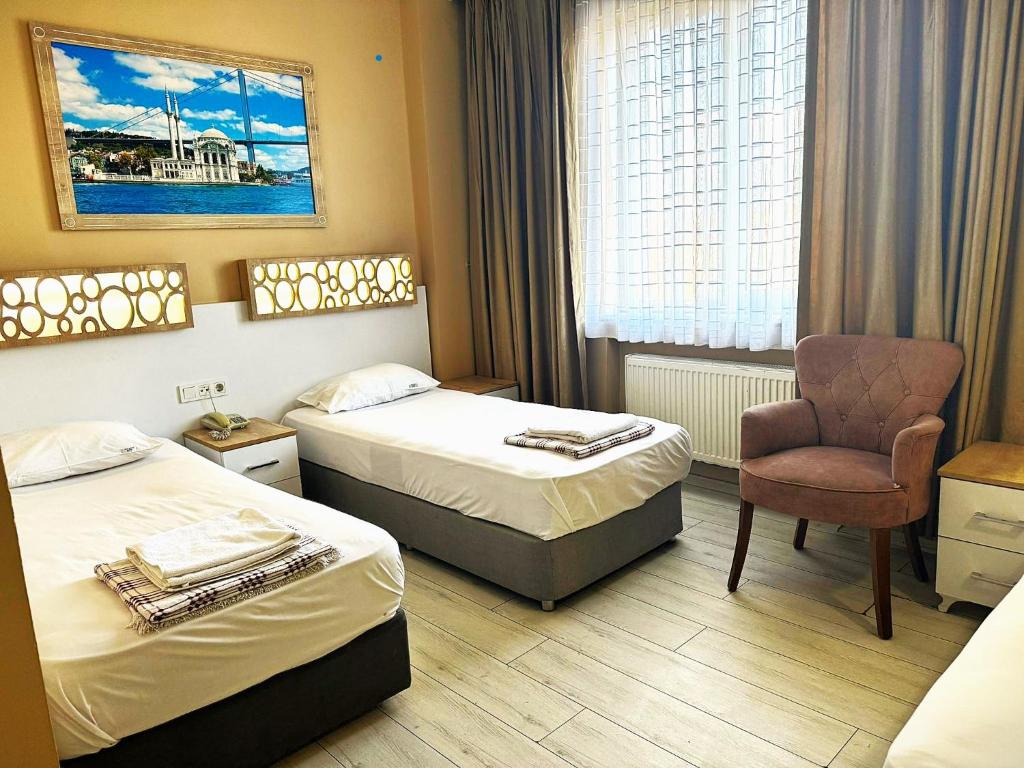 Postel nebo postele na pokoji v ubytování GRAND VATAN HOTEL
