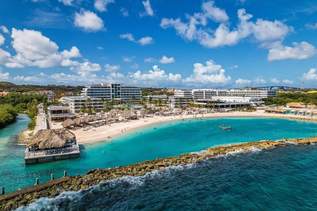 an aerial view of a beach and buildings at Mangrove Beach Corendon Curacao All-Inclusive Resort, Curio by Hilton in Willemstad