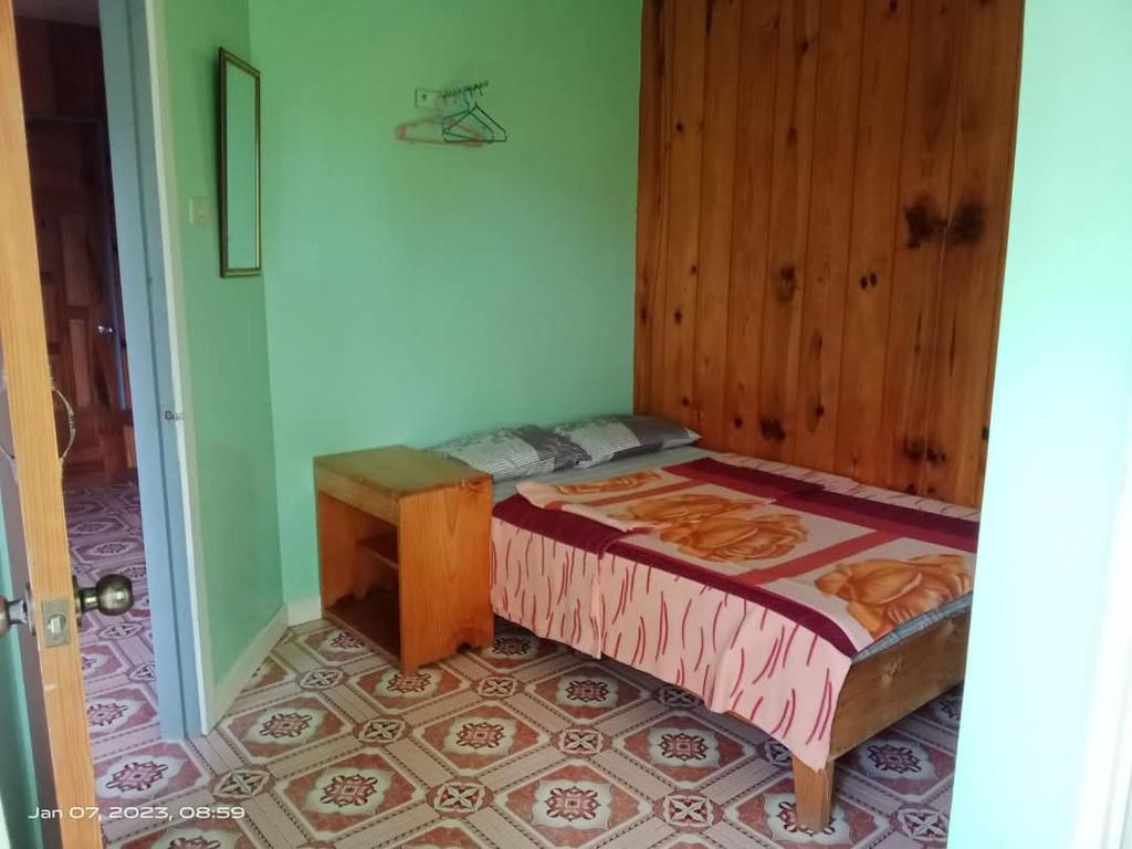 Postel nebo postele na pokoji v ubytování Hidden Hill Inn