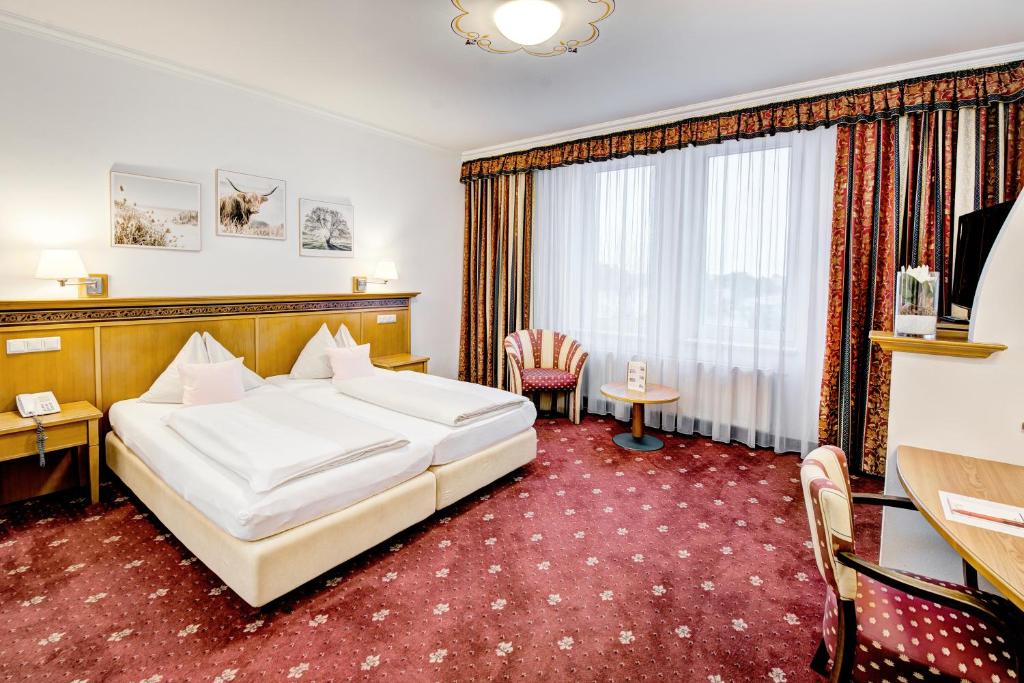 Postel nebo postele na pokoji v ubytování Hotel Alexandra