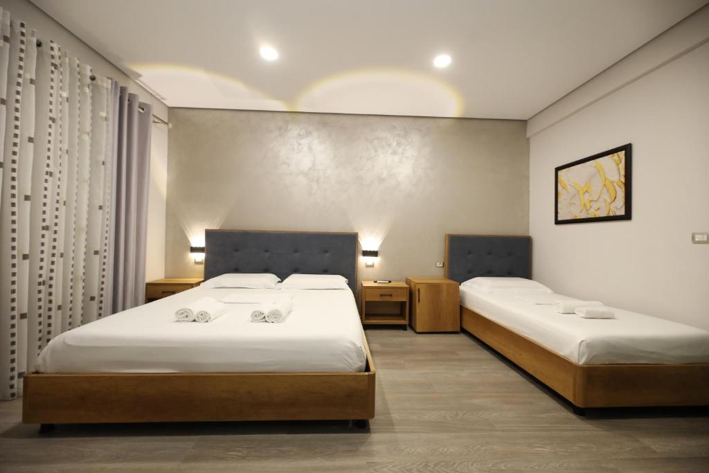 Postel nebo postele na pokoji v ubytování Hotel Salvadore