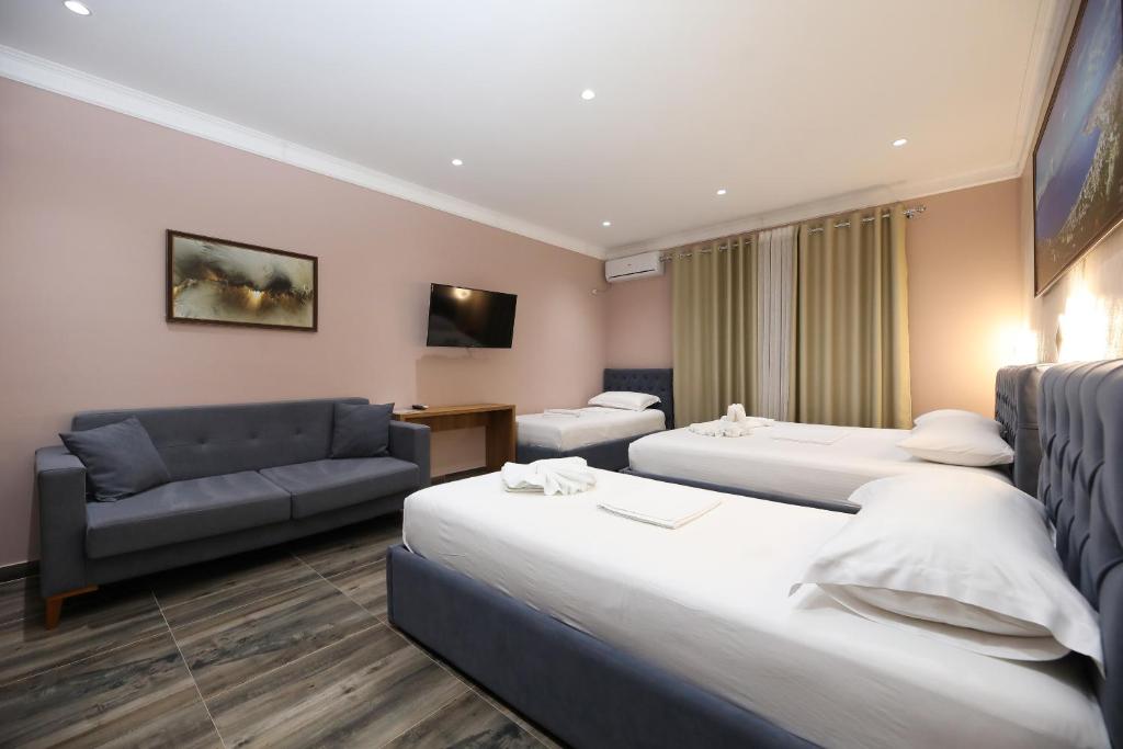 Postel nebo postele na pokoji v ubytování Hotel Salvadore