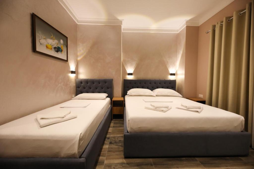 Postel nebo postele na pokoji v ubytování Hotel Salvadore
