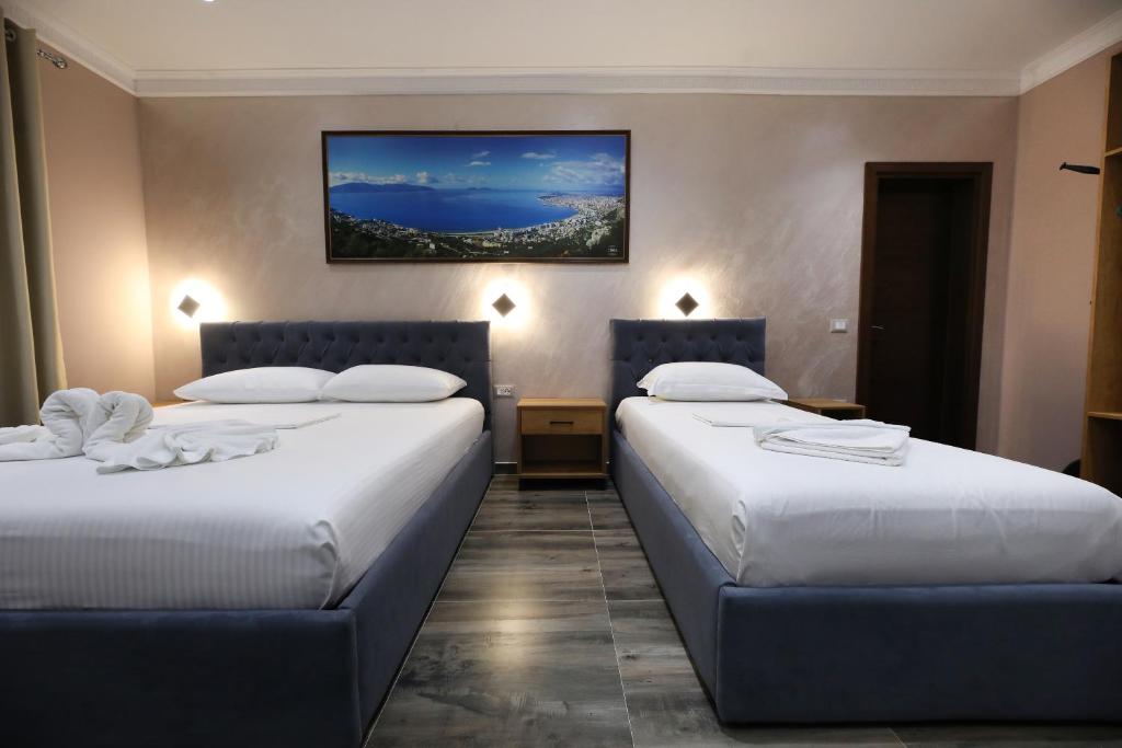Postel nebo postele na pokoji v ubytování Hotel Salvadore