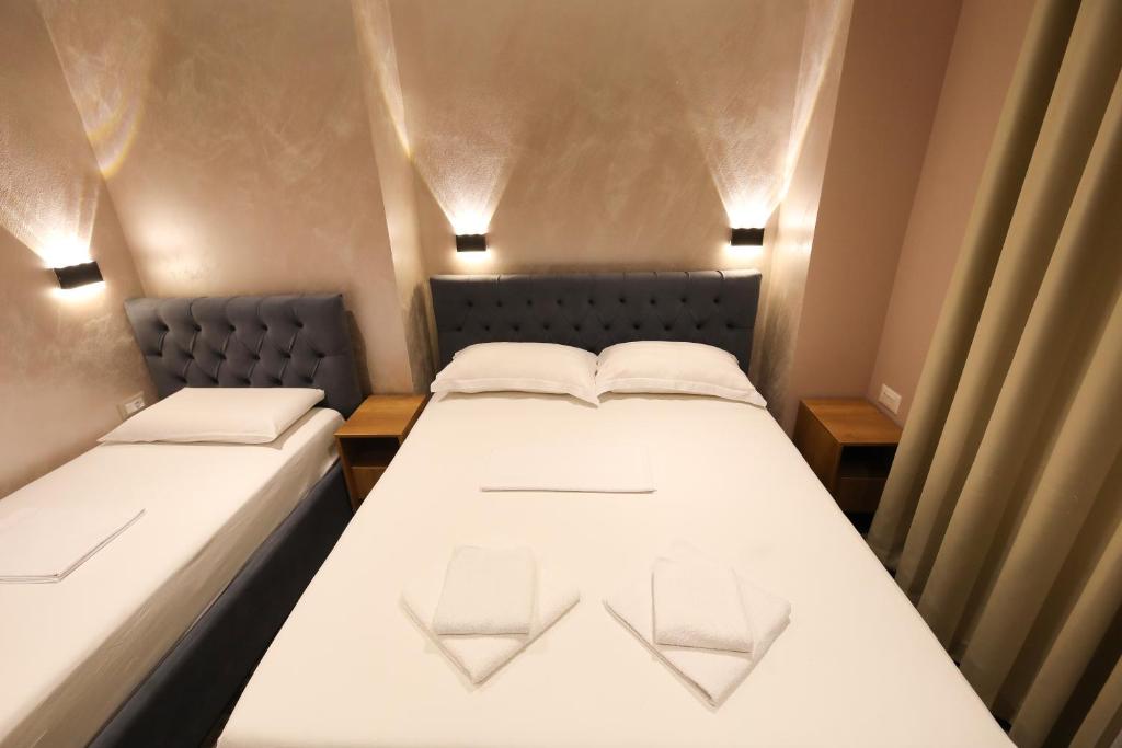 Postel nebo postele na pokoji v ubytování Hotel Salvadore
