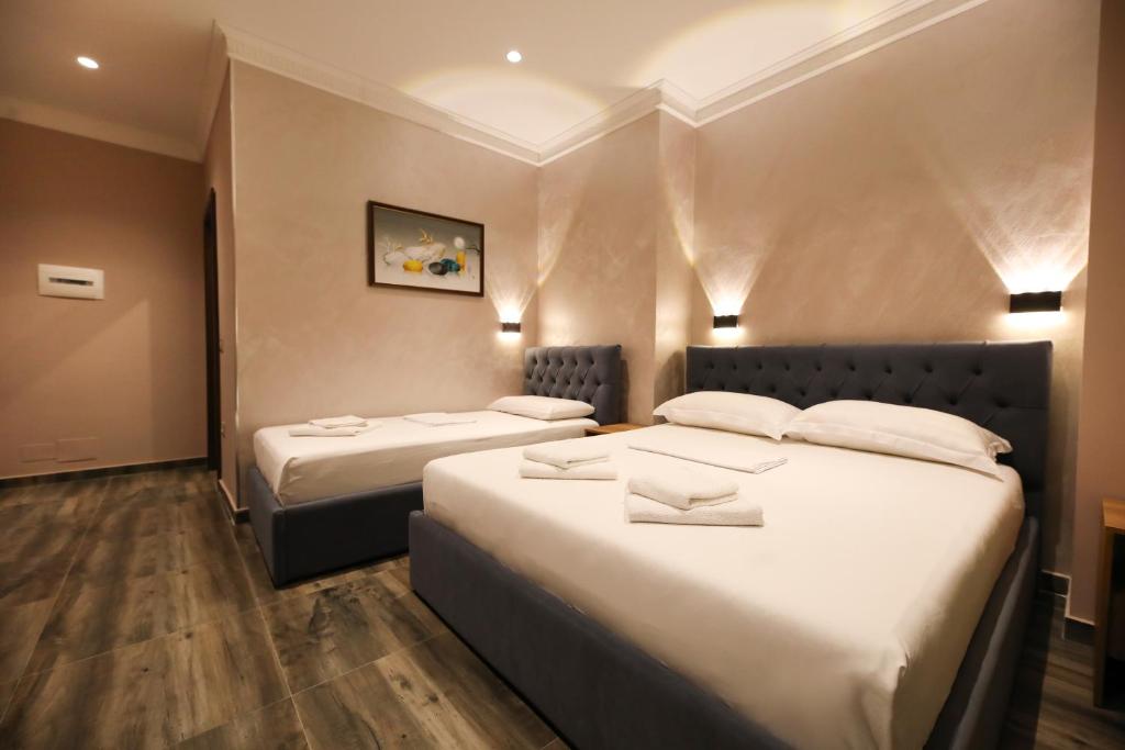 Postel nebo postele na pokoji v ubytování Hotel Salvadore