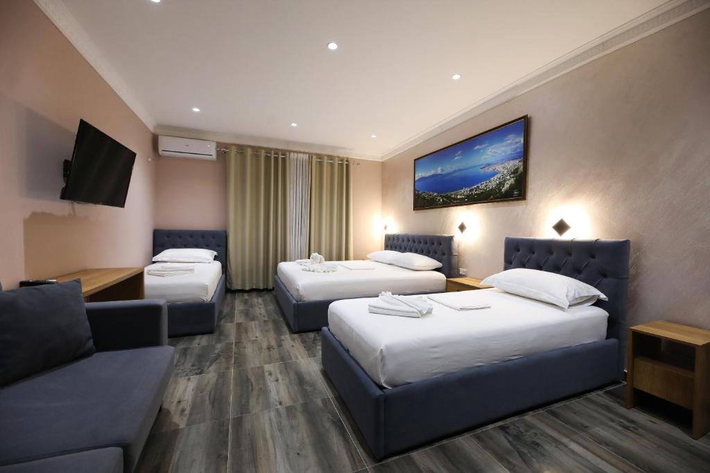 Postel nebo postele na pokoji v ubytování Hotel Salvadore