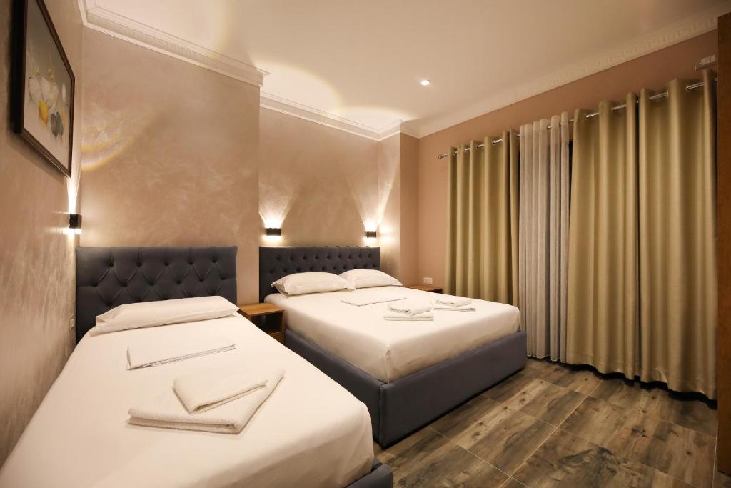 Postel nebo postele na pokoji v ubytování Hotel Salvadore