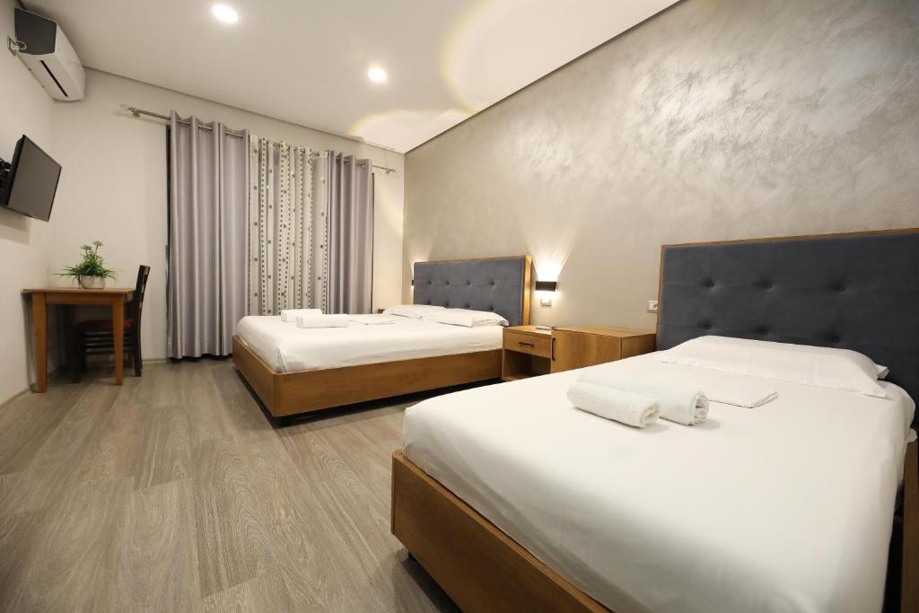 Postel nebo postele na pokoji v ubytování Hotel Salvadore