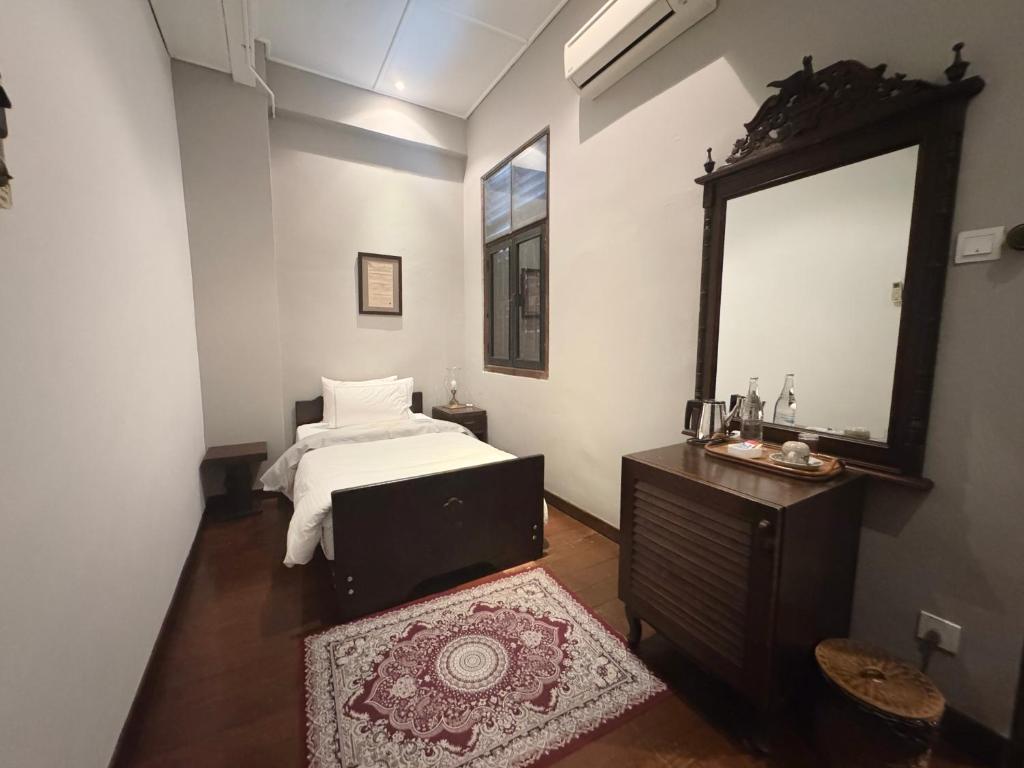 Postel nebo postele na pokoji v ubytování Museum Hotel