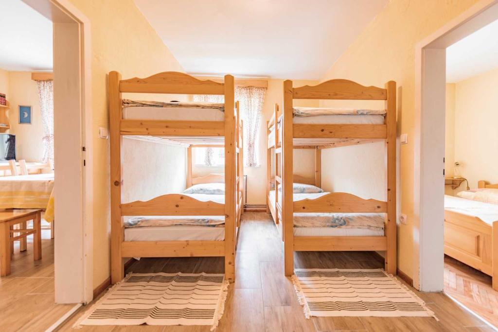 Postel nebo postele na pokoji v ubytování APARTMENTS ROGLA JURGOVO - Ski in Ski out