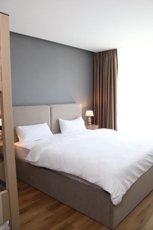 Postel nebo postele na pokoji v ubytování Hayat Sky Hotel Rust