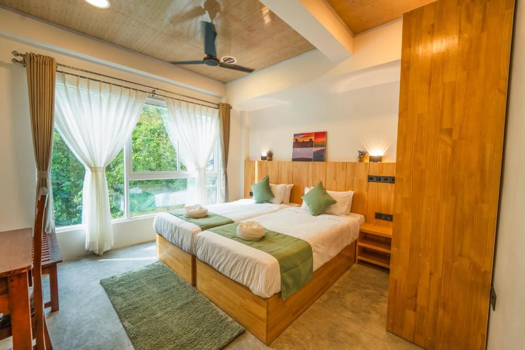 Postel nebo postele na pokoji v ubytování Blissview Maldives - Thulusdhoo