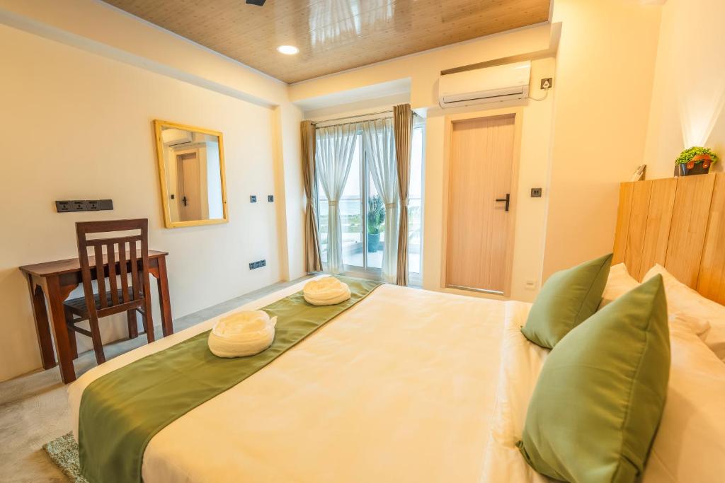 Postel nebo postele na pokoji v ubytování Blissview Maldives - Thulusdhoo