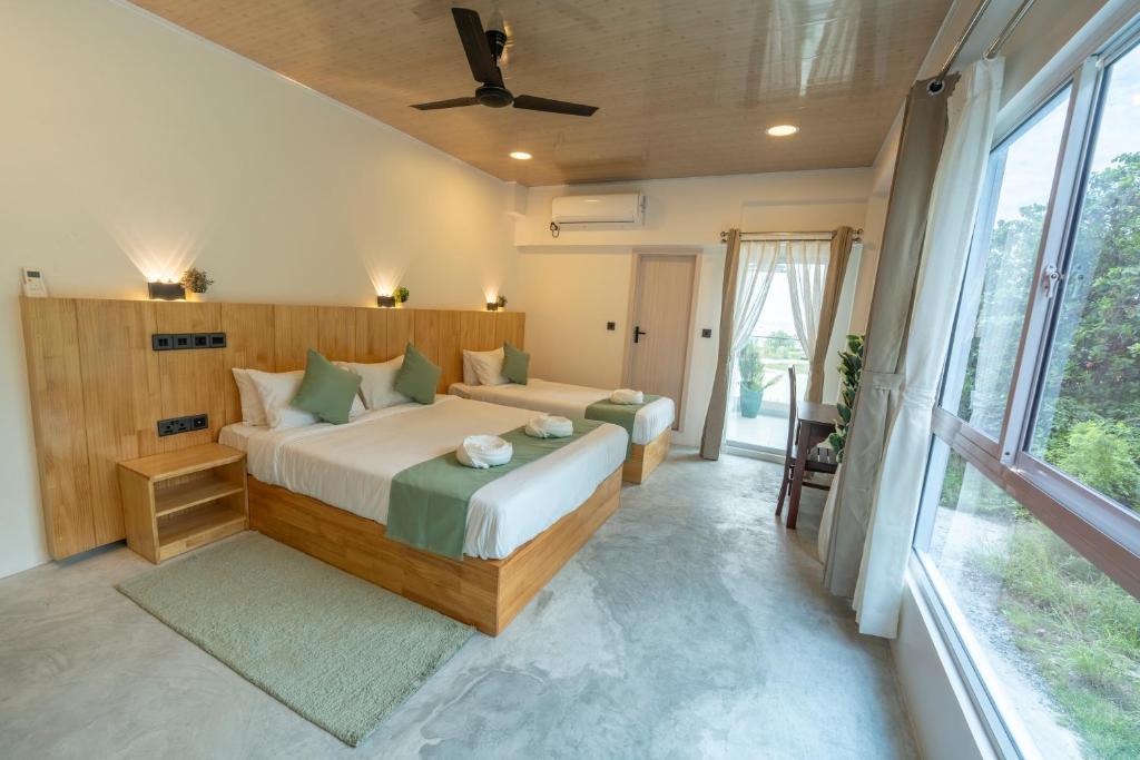 Postel nebo postele na pokoji v ubytování Blissview Maldives - Thulusdhoo