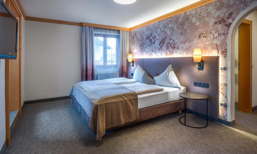 Postel nebo postele na pokoji v ubytování Hotel Königgut