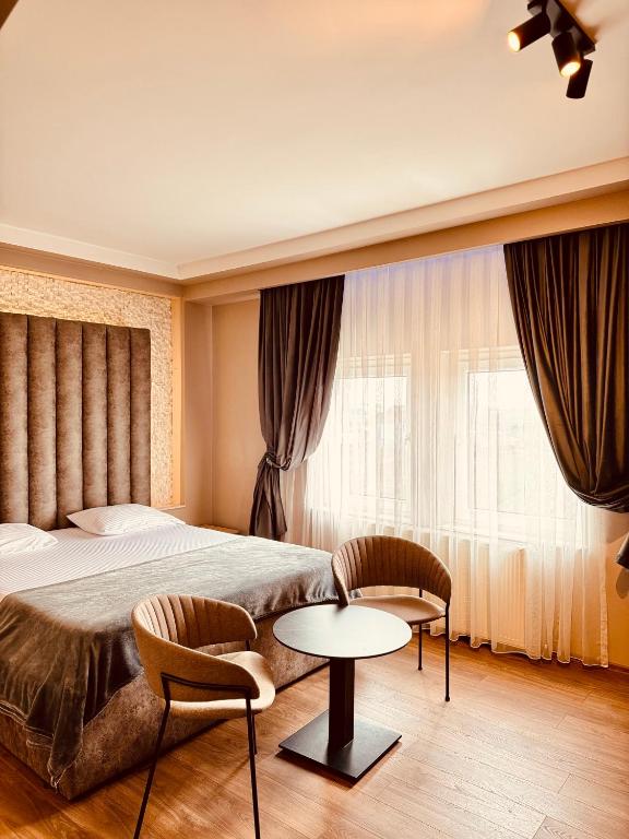 Postel nebo postele na pokoji v ubytování Vera HOTEL-VILLA