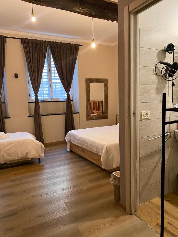 Postel nebo postele na pokoji v ubytování Piccolo Borgo