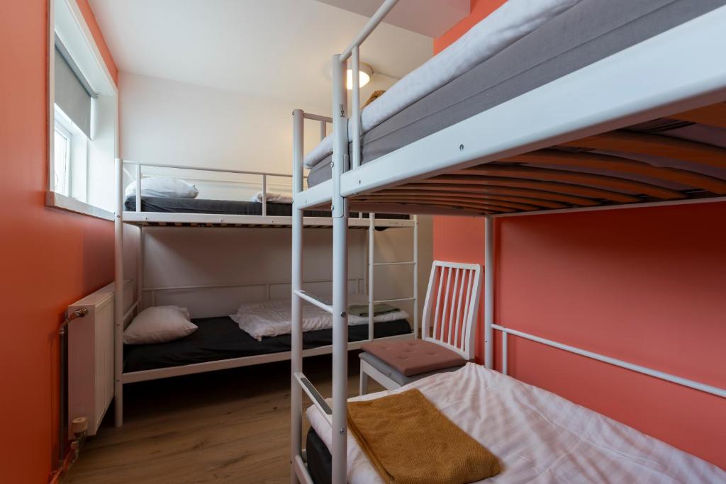 Postel nebo postele na pokoji v ubytování Hostel Fjordur