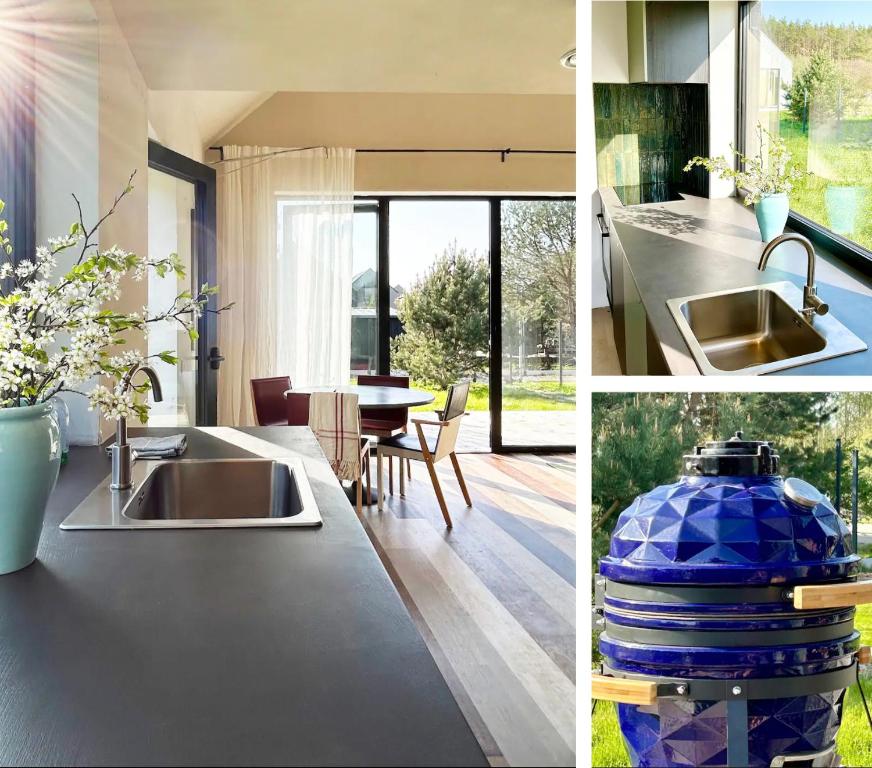 a kitchen with a sink and a dining room at Laimingi namai in Palanga