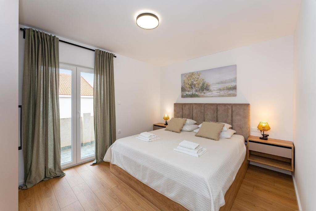 Postel nebo postele na pokoji v ubytování Villa Almaris