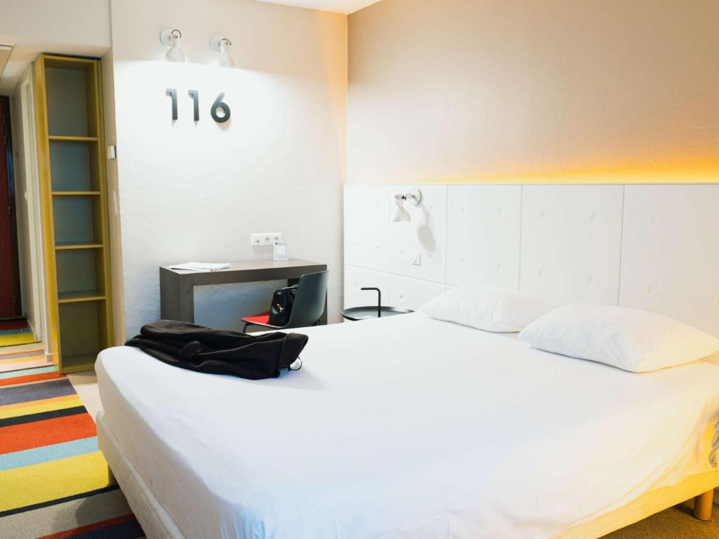 Postel nebo postele na pokoji v ubytování ibis Styles Lyon Sud Vienne