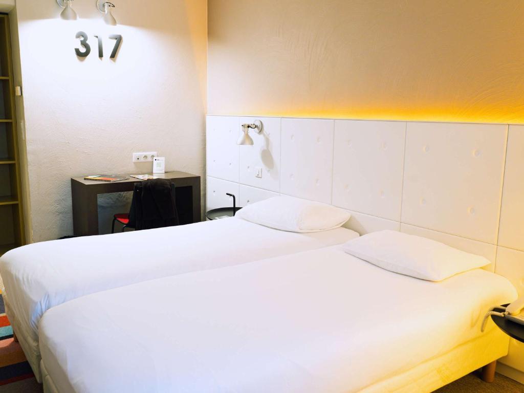 Postel nebo postele na pokoji v ubytování ibis Styles Lyon Sud Vienne