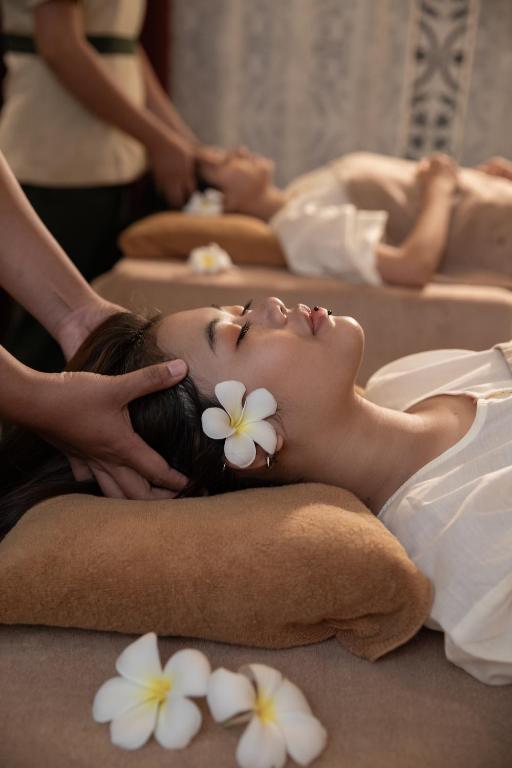 a woman getting a massage at a spa at Lynnaya Urban River Resort in Siem Reap