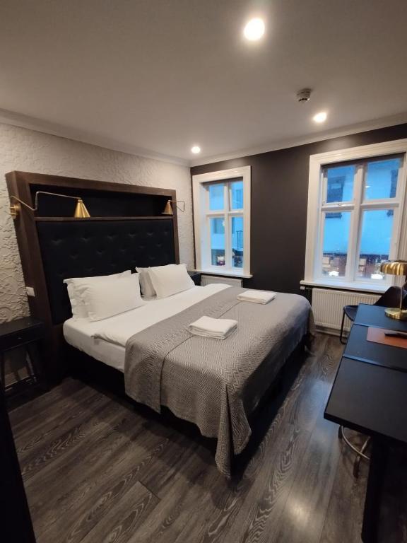 Postel nebo postele na pokoji v ubytování Vintage Apartment Hotel