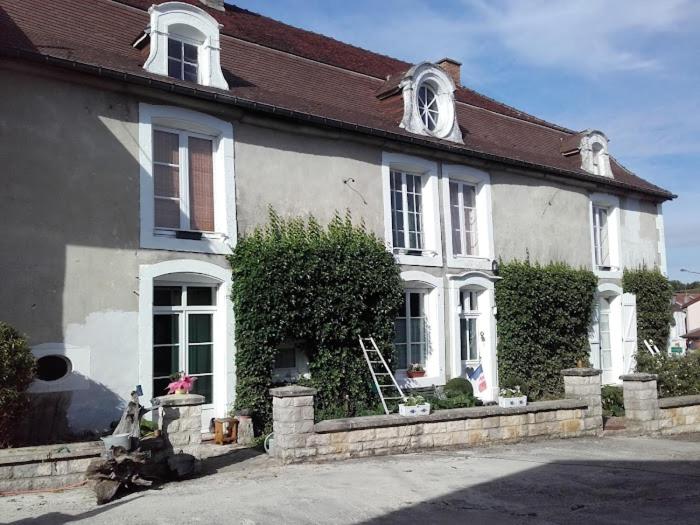 a white house with a brown roof at Chambres d'hotes la Fromagerie du Relais Postal Royal in Colombey-les-deux-Églises