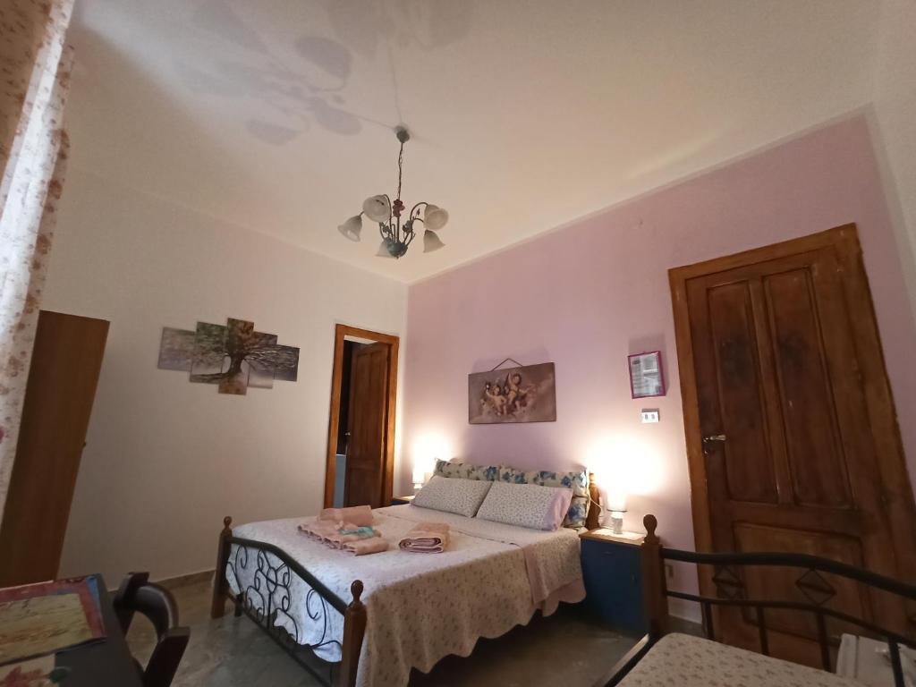 Postel nebo postele na pokoji v ubytování B&B Le 4 Stagioni sul viale, belvedere di Agrigento