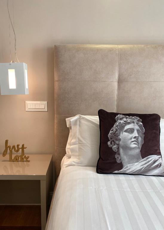 Łóżko lub łóżka w pokoju w obiekcie Terrazza Marco Antonio Luxury Suite