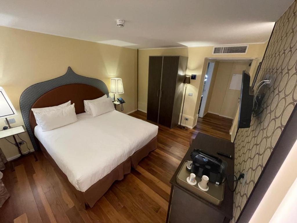 Postel nebo postele na pokoji v ubytování Albergo San Marco
