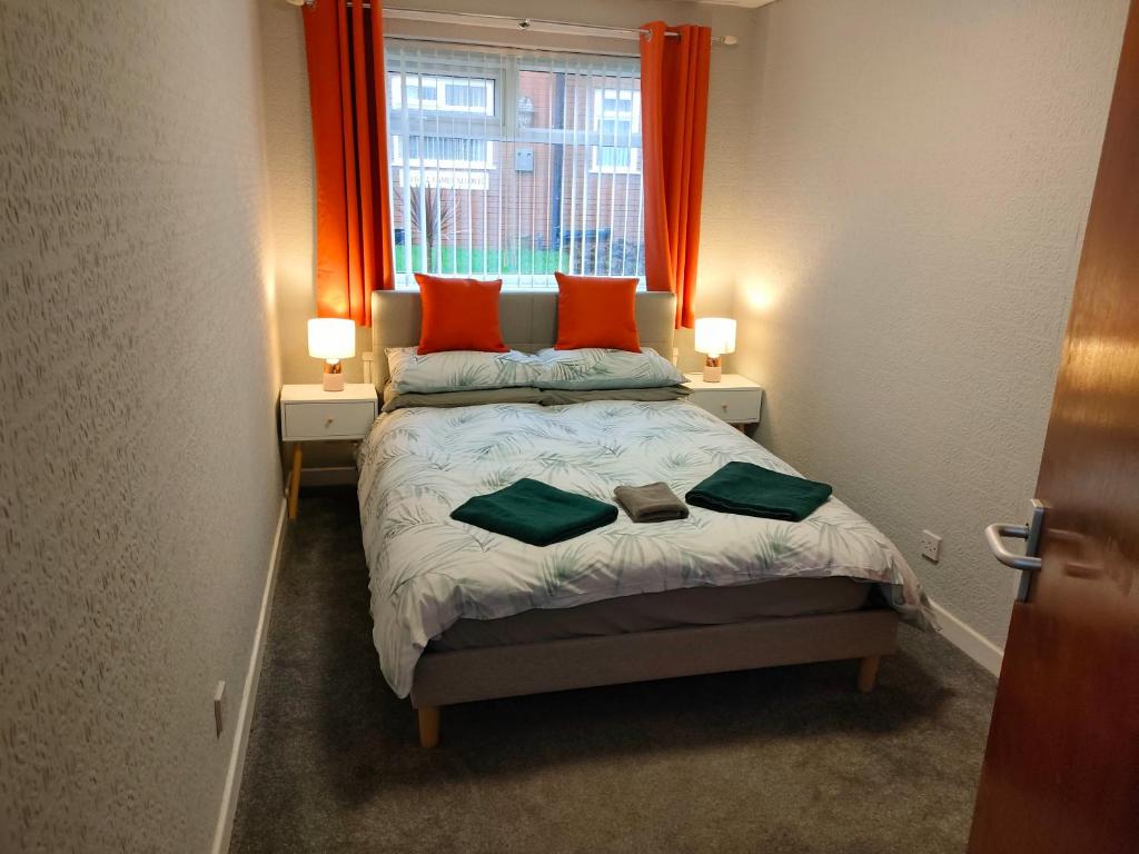 Postel nebo postele na pokoji v ubytování San Remo Apartments Blackpool