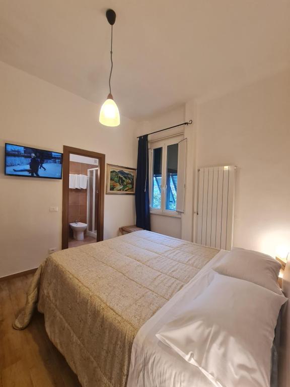 Postel nebo postele na pokoji v ubytování Albergo Genio