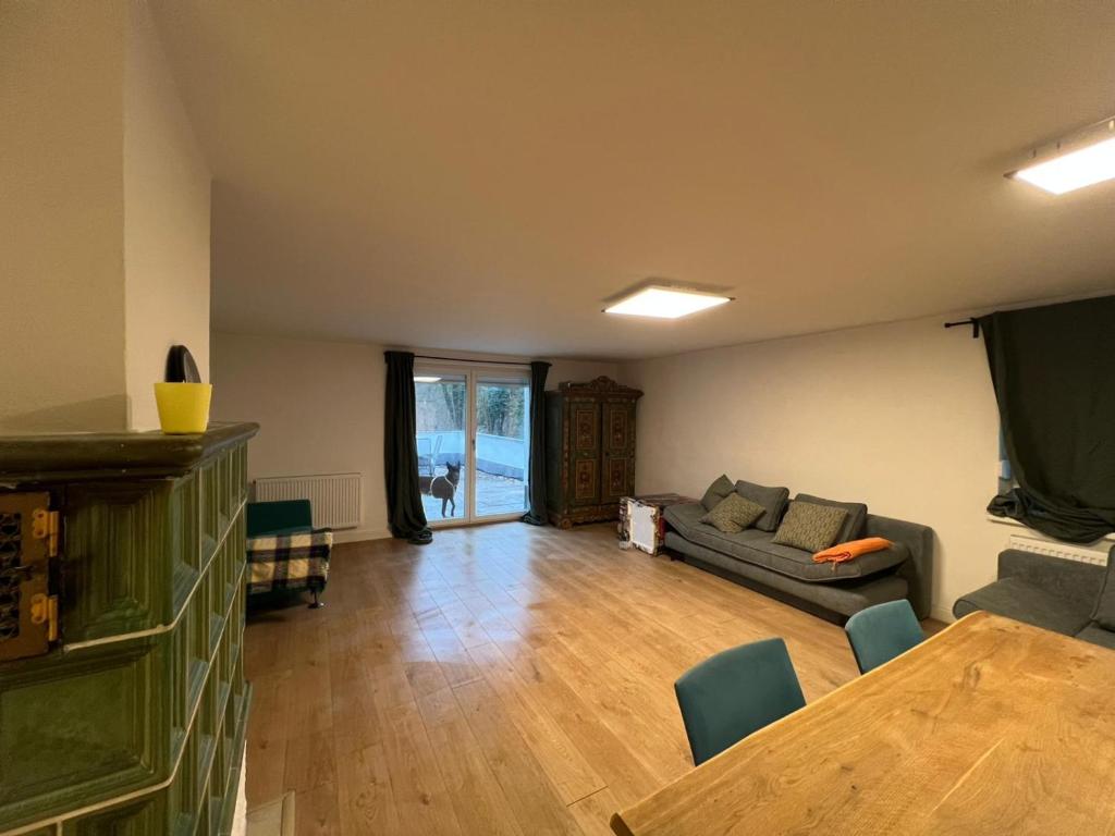 a living room with a couch and a table at Natur pur Katharina in Kraiburg am Inn