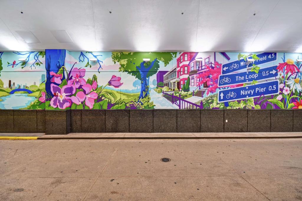 a mural on the side of a building with flowers at Embassy Suites by Hilton Chicago Downtown Magnificent Mile in Chicago