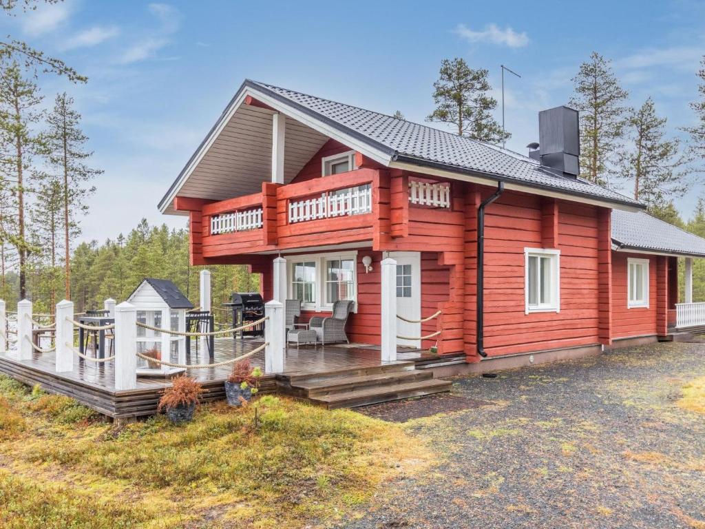 a log cabin with a porch and a deck at Holiday Home Onnimanni by Interhome in Kuusamo