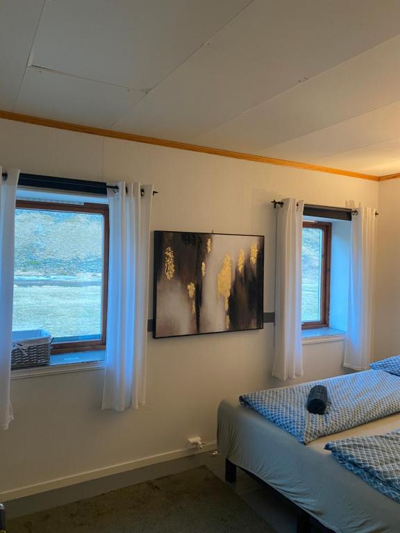 Postel nebo postele na pokoji v ubytování Unstad Surfpacker