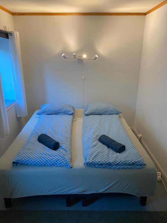 Postel nebo postele na pokoji v ubytování Unstad Surfpacker