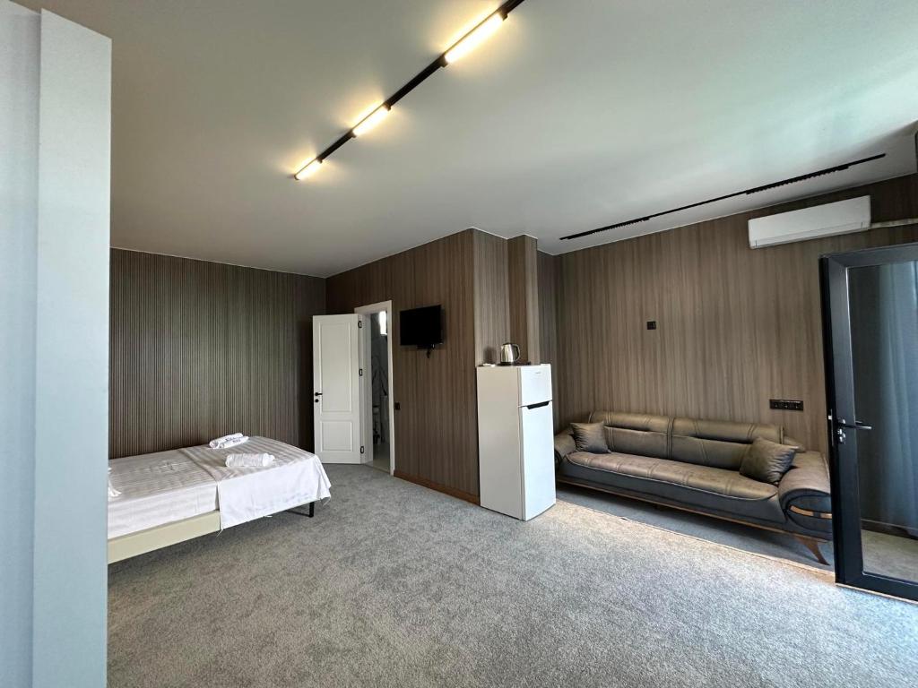 Rúm í herbergi á Elite Hotel Kobuleti