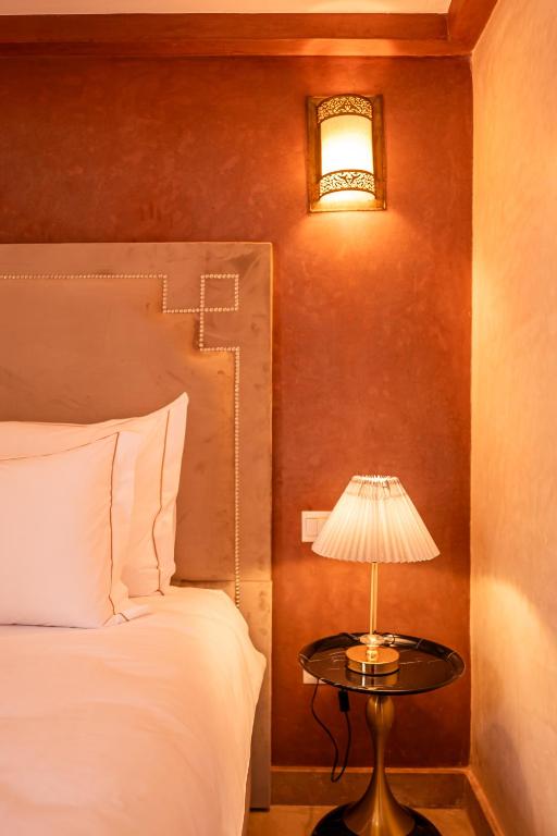 Postel nebo postele na pokoji v ubytování Palais Menzah & SPA