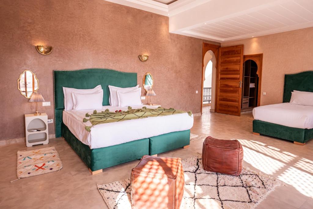 Postel nebo postele na pokoji v ubytování Palais Menzah & SPA