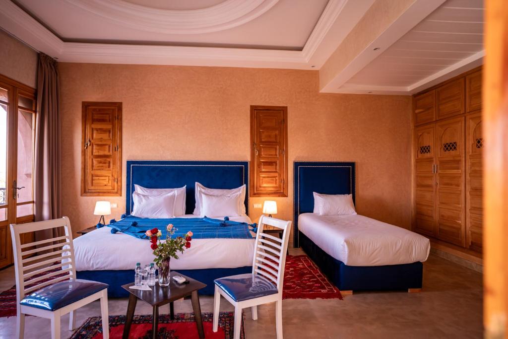 Postel nebo postele na pokoji v ubytování Palais Menzah & SPA